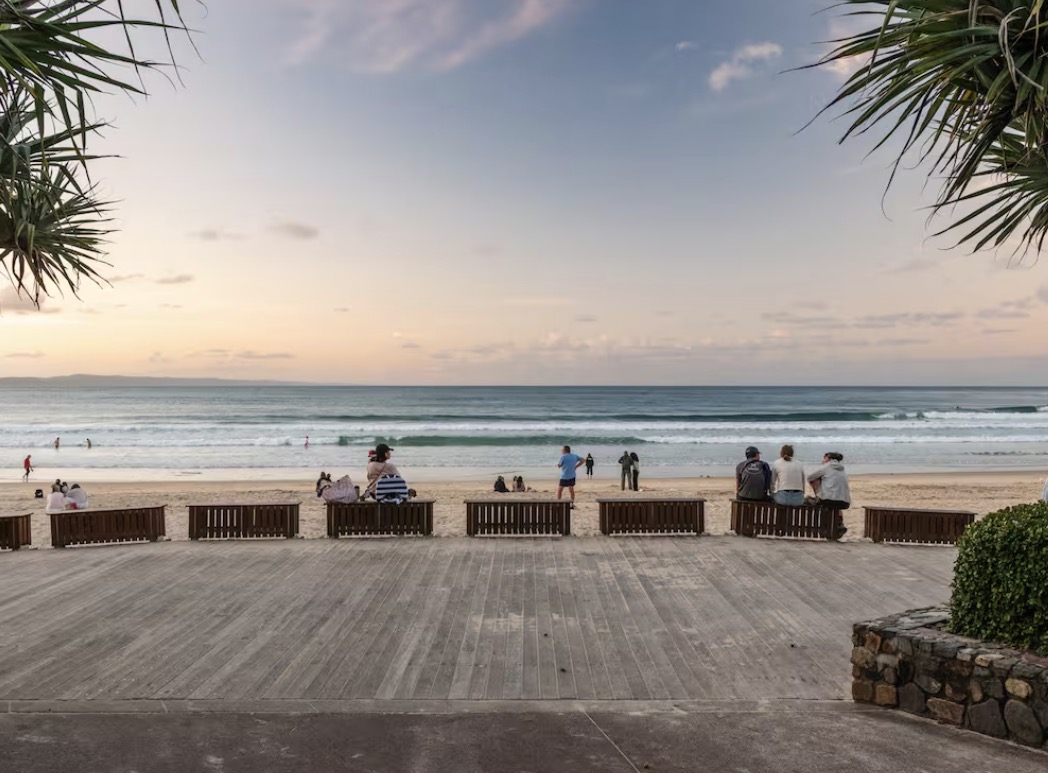 Noosa Main Beach boardwalk and surf at dusk